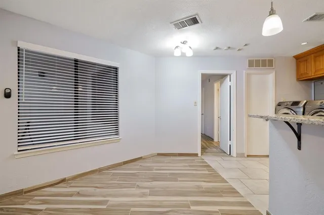 a view of a livingroom and a window