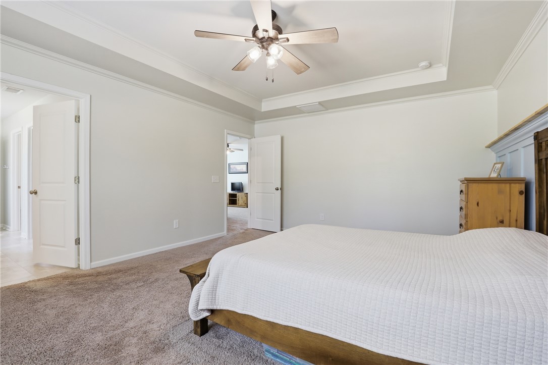 36 Chalet Court Anderson, SC 29621 - Photo 15 of 30 This spacious bedroom offers a tranquil retreat with plush carpeting and an elegant tray ceiling.