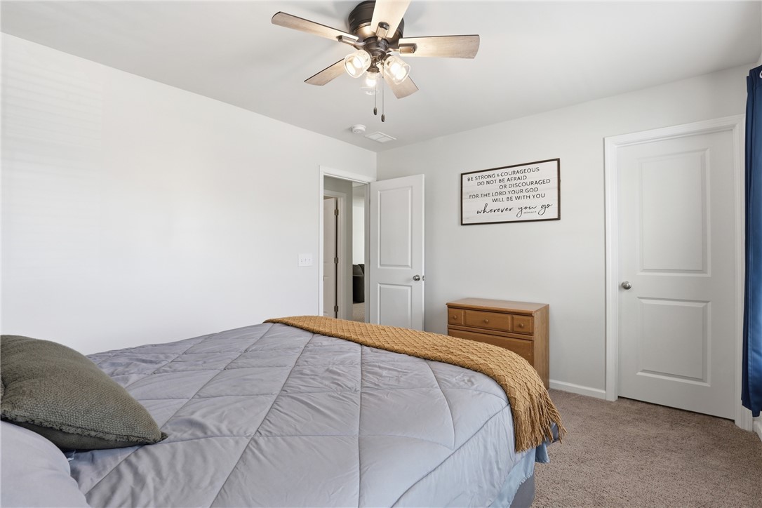 36 Chalet Court Anderson, SC 29621 - Photo 19 of 30 This serene bedroom offers a comfortable retreat with soft lighting and ample space for relaxation.