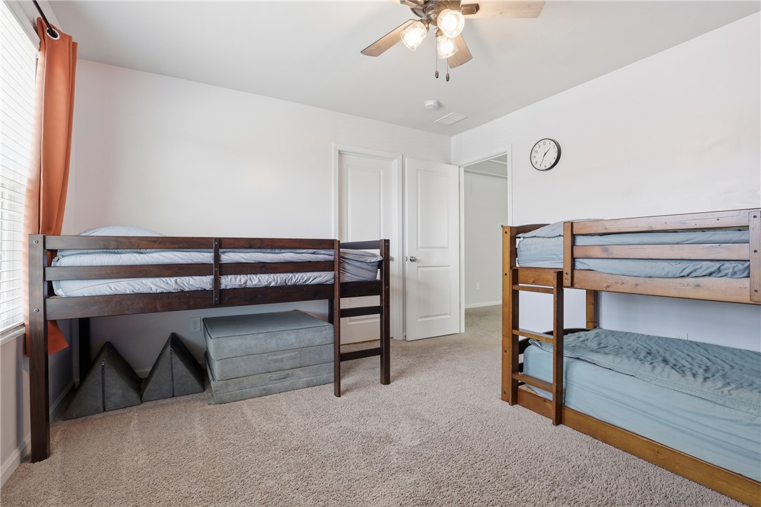 36 Chalet Court Anderson, SC 29621 - Photo 22 of 30 This spacious bedroom offers ample natural light and comfortable carpeting, ideal for a peaceful retreat.