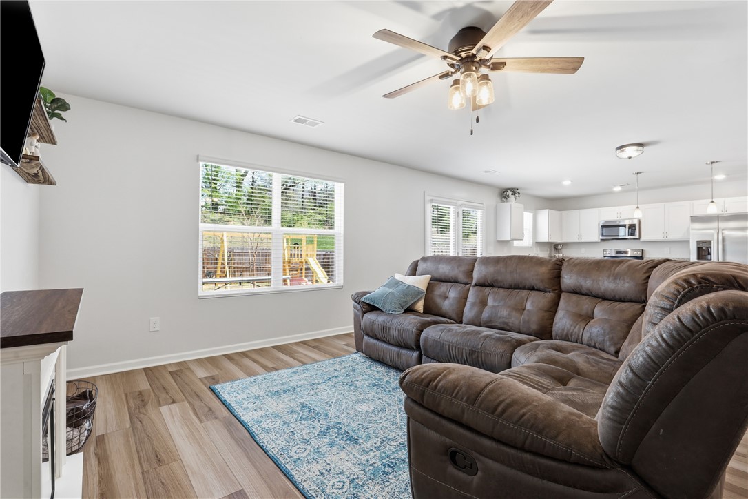36 Chalet Court Anderson, SC 29621 - Photo 29 of 30 This inviting living area boasts an open floor plan, warm flooring, and abundant natural light.