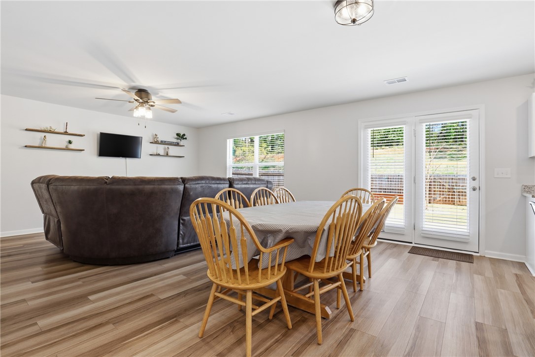 36 Chalet Court Anderson, SC 29621 - Photo 6 of 30 This bright, open-concept living space features durable flooring and convenient outdoor access.