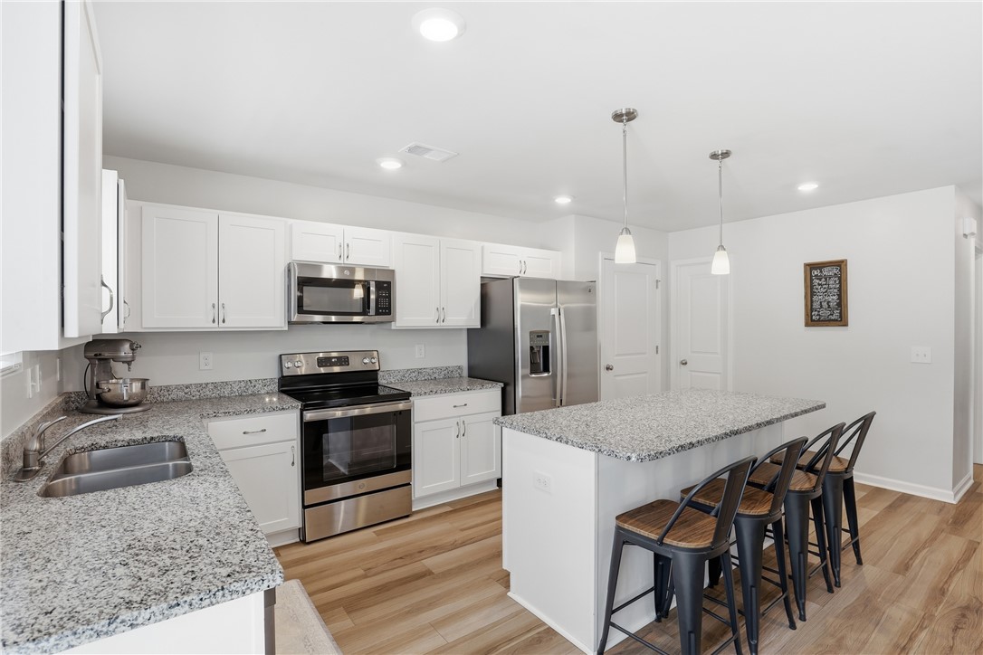 36 Chalet Court Anderson, SC 29621 - Photo 9 of 30 This bright kitchen features ample counter space and modern appliances, perfect for everyday living.