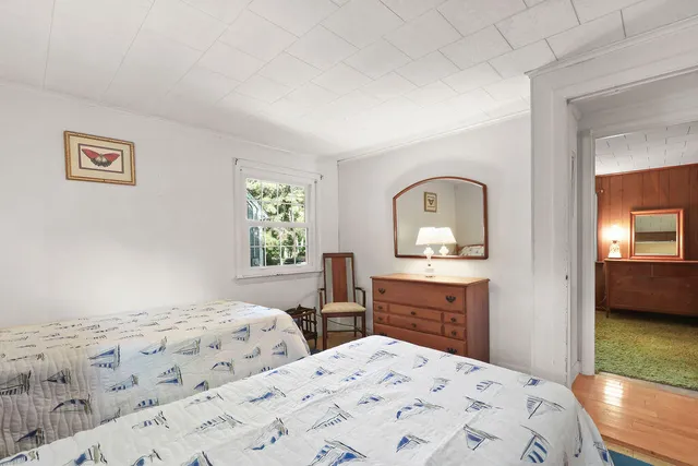 a bedroom with a bed and a view of bathroom