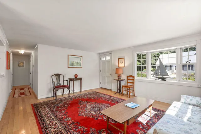 a living room with furniture and a table