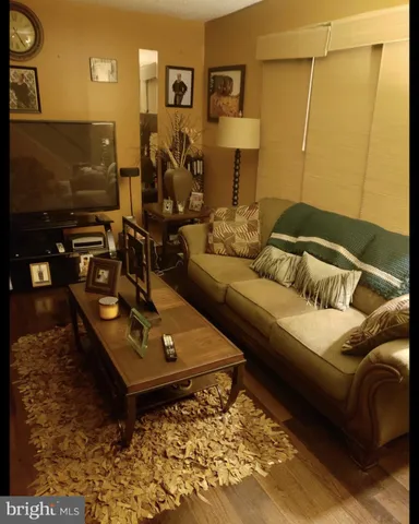 a living room with a couch and a flat screen tv