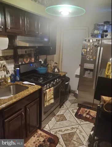 a kitchen with a stove and cabinets