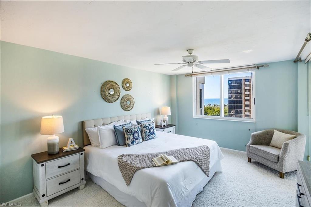 21 Bluebill Avenue, Unit B806 Naples, FL 34108 - Photo 12 of 22 a bedroom with bed and window