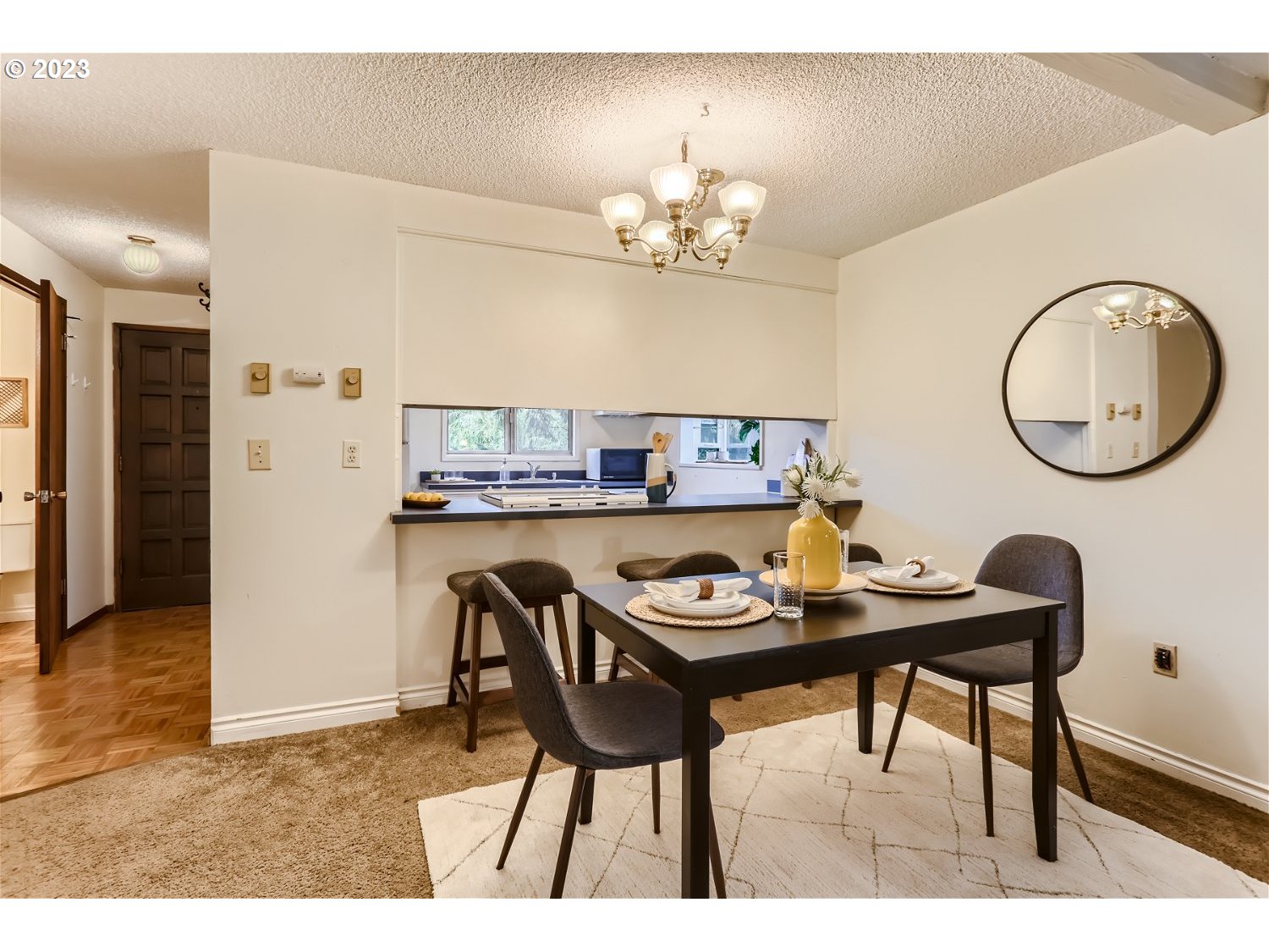 7410 South Virginia Avenue Portland, OR 97219 - Photo 11 of 27 a view of a dining room with furniture and chandelier