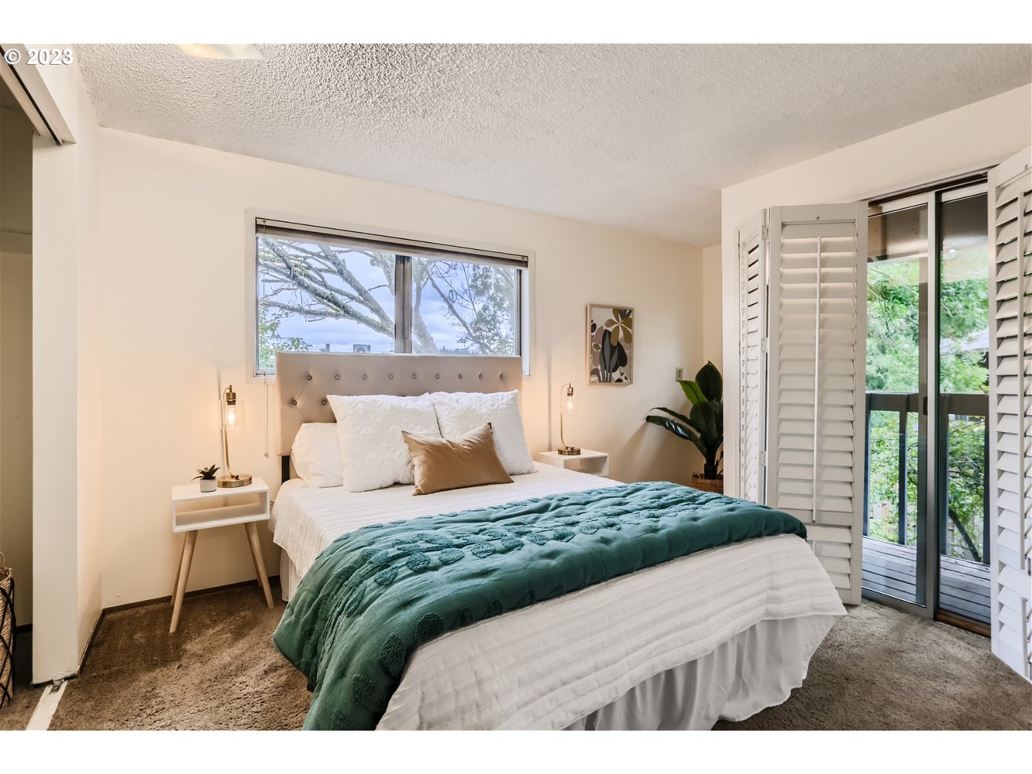 7410 South Virginia Avenue Portland, OR 97219 - Photo 15 of 27 a bedroom with a bed and a large window