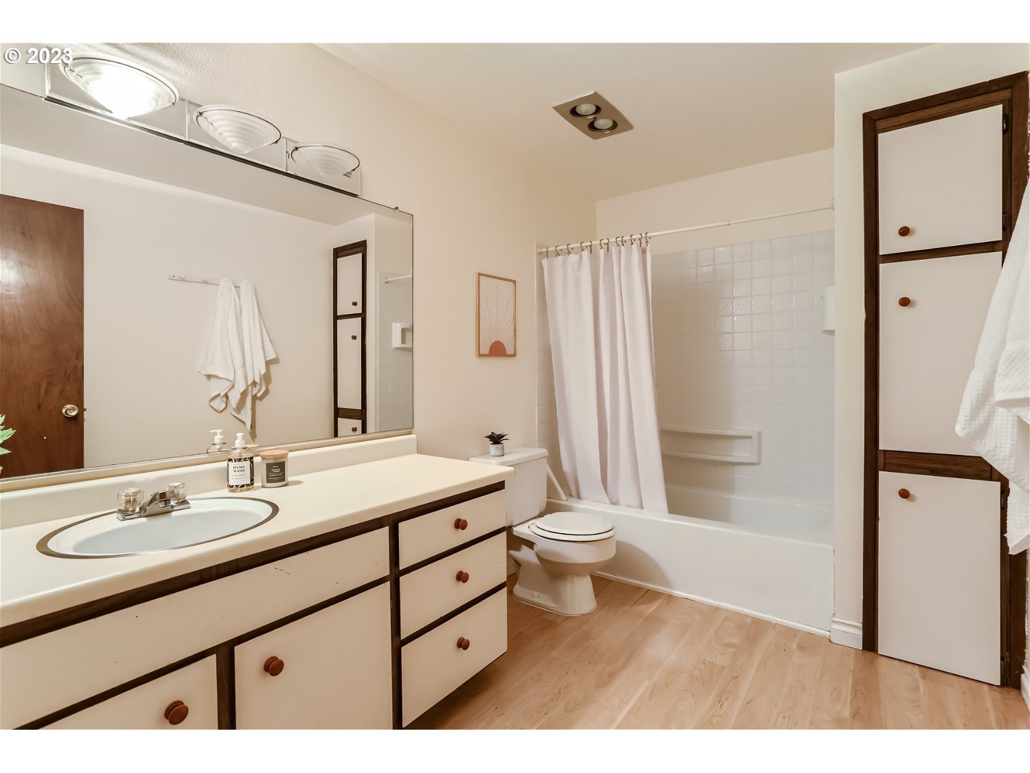 7410 South Virginia Avenue Portland, OR 97219 - Photo 18 of 27 a bathroom with a double vanity sink toilet mirror and shower
