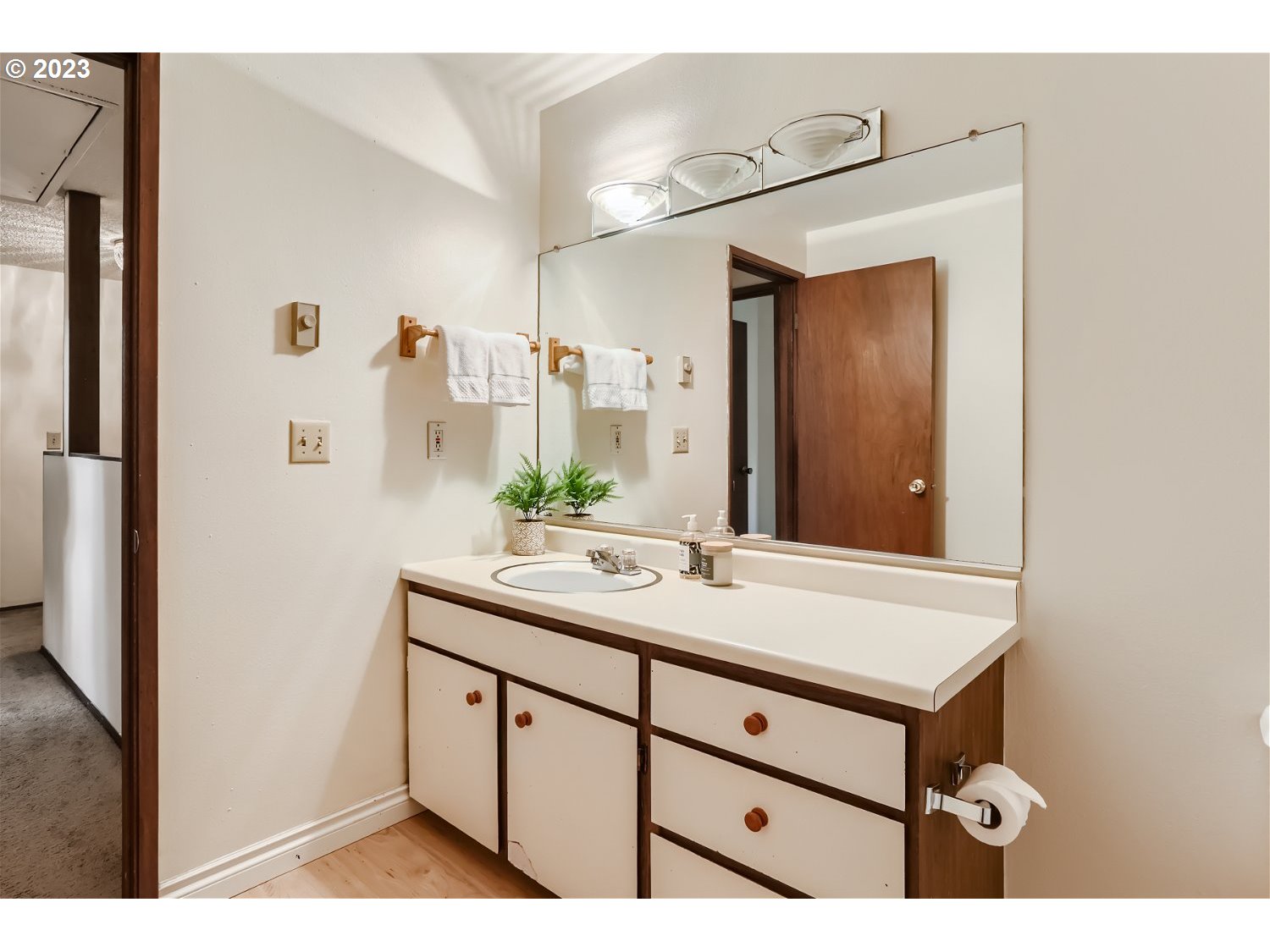 7410 South Virginia Avenue Portland, OR 97219 - Photo 19 of 27 a bathroom with a sink vanity granite and a mirror