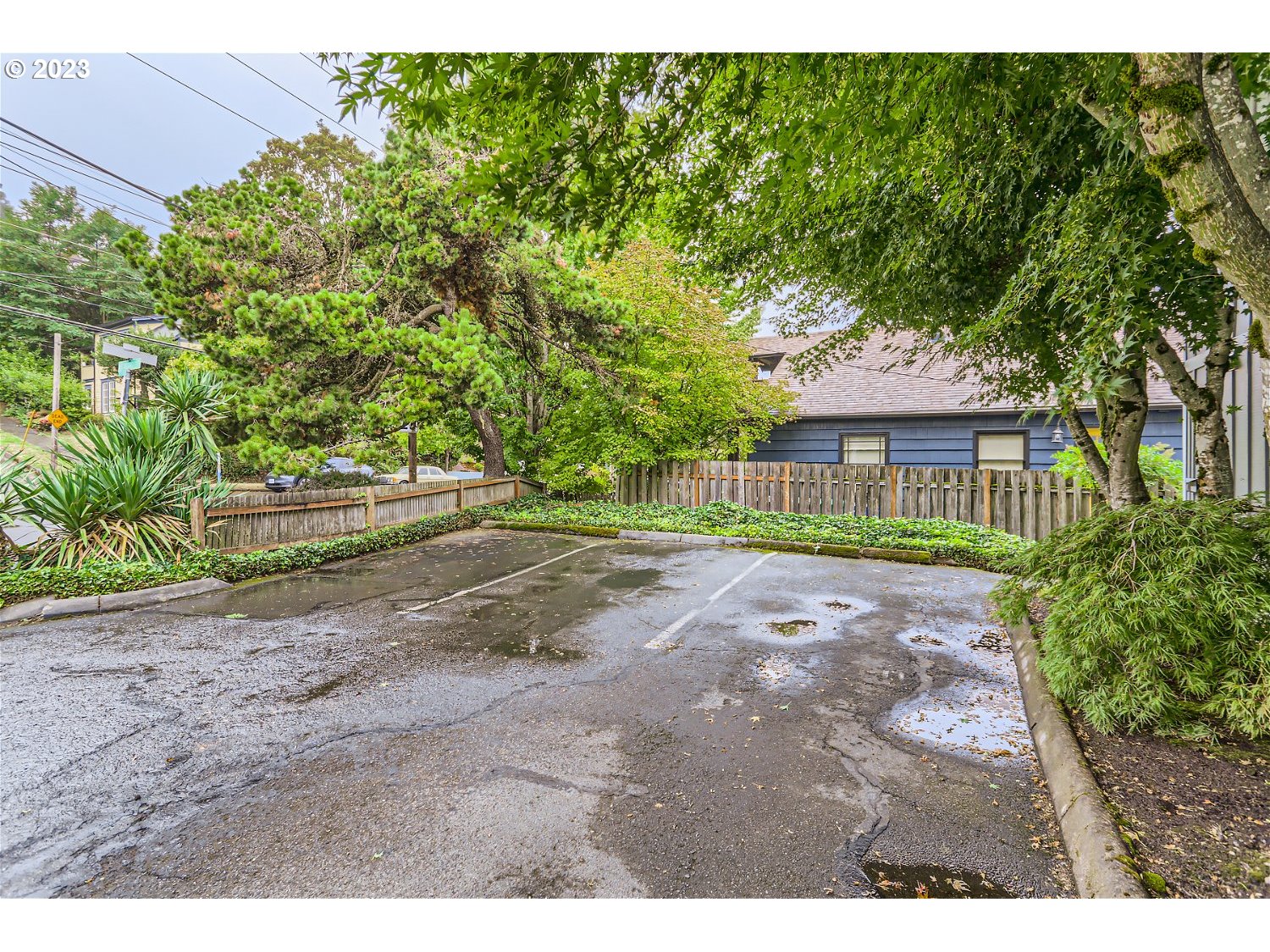 7410 South Virginia Avenue Portland, OR 97219 - Photo 27 of 27 a view of an house with backyard and a tree