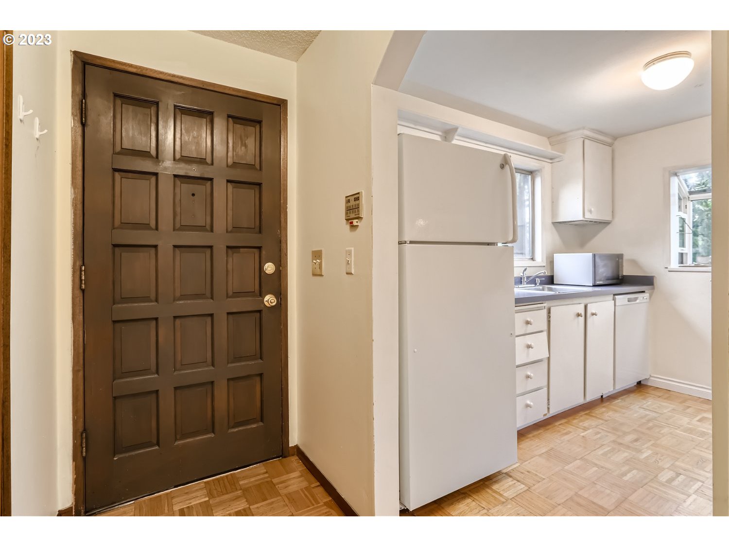 7410 South Virginia Avenue Portland, OR 97219 - Photo 3 of 27 a kitchen with a refrigerator and cabinets