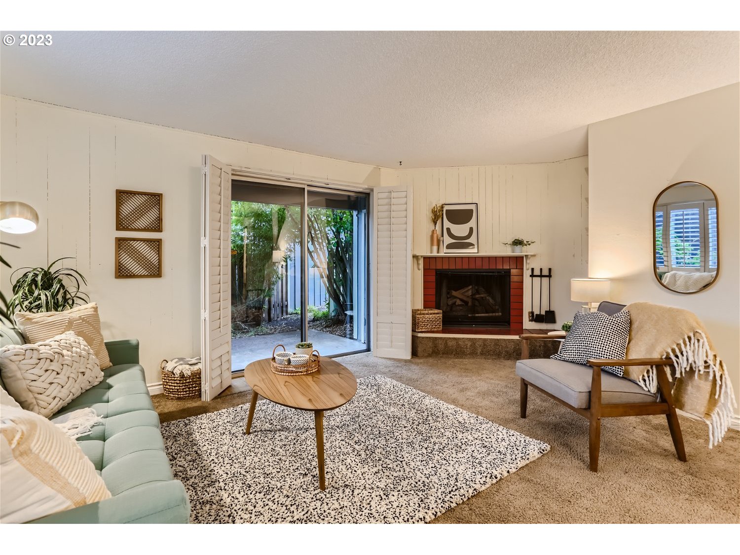 7410 South Virginia Avenue Portland, OR 97219 - Photo 9 of 27 a living room with furniture and a fireplace