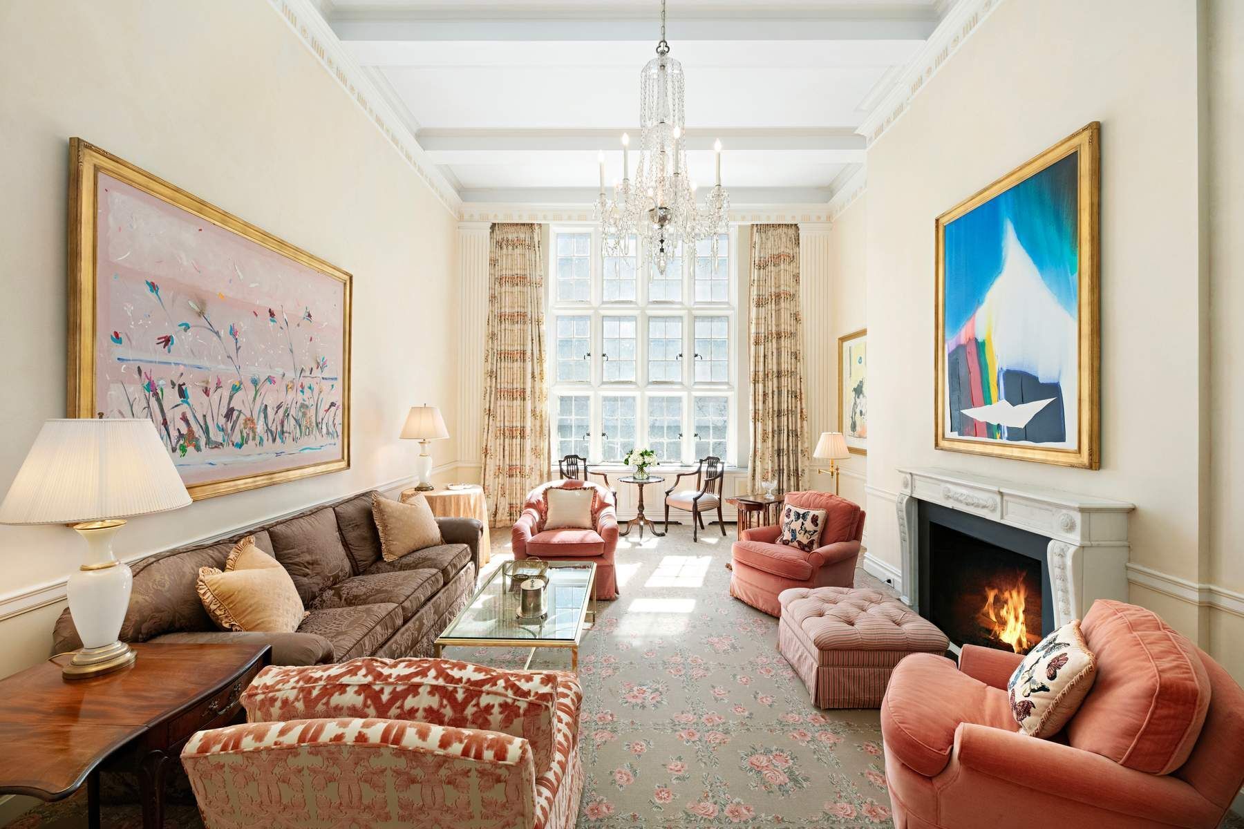 14 East 75th Street, Unit 4A Manhattan, NY 10021 - Photo 1 of 12 a living room with furniture a large window and a fireplace