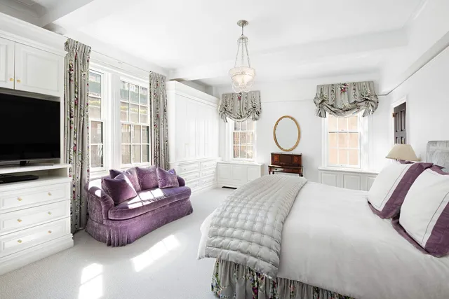 a view of a livingroom with furniture and a flat screen tv