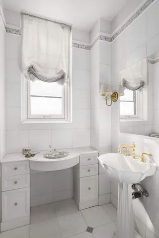 a spacious bedroom with bed and a flat screen tv