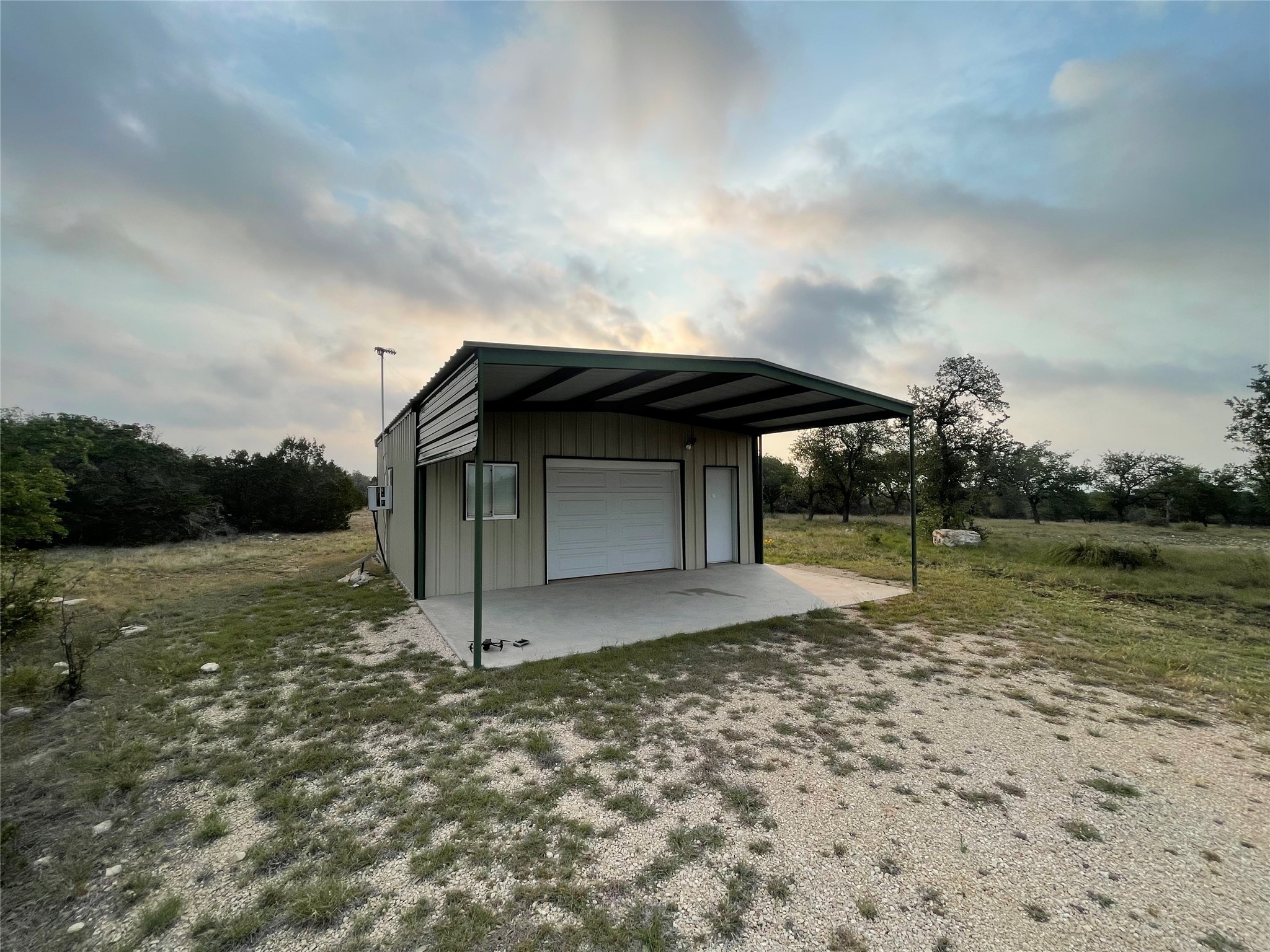 220 Rattlesnake Road Northwest Junction, TX 76849 - Photo 14 of 38 a view of a house with backyard