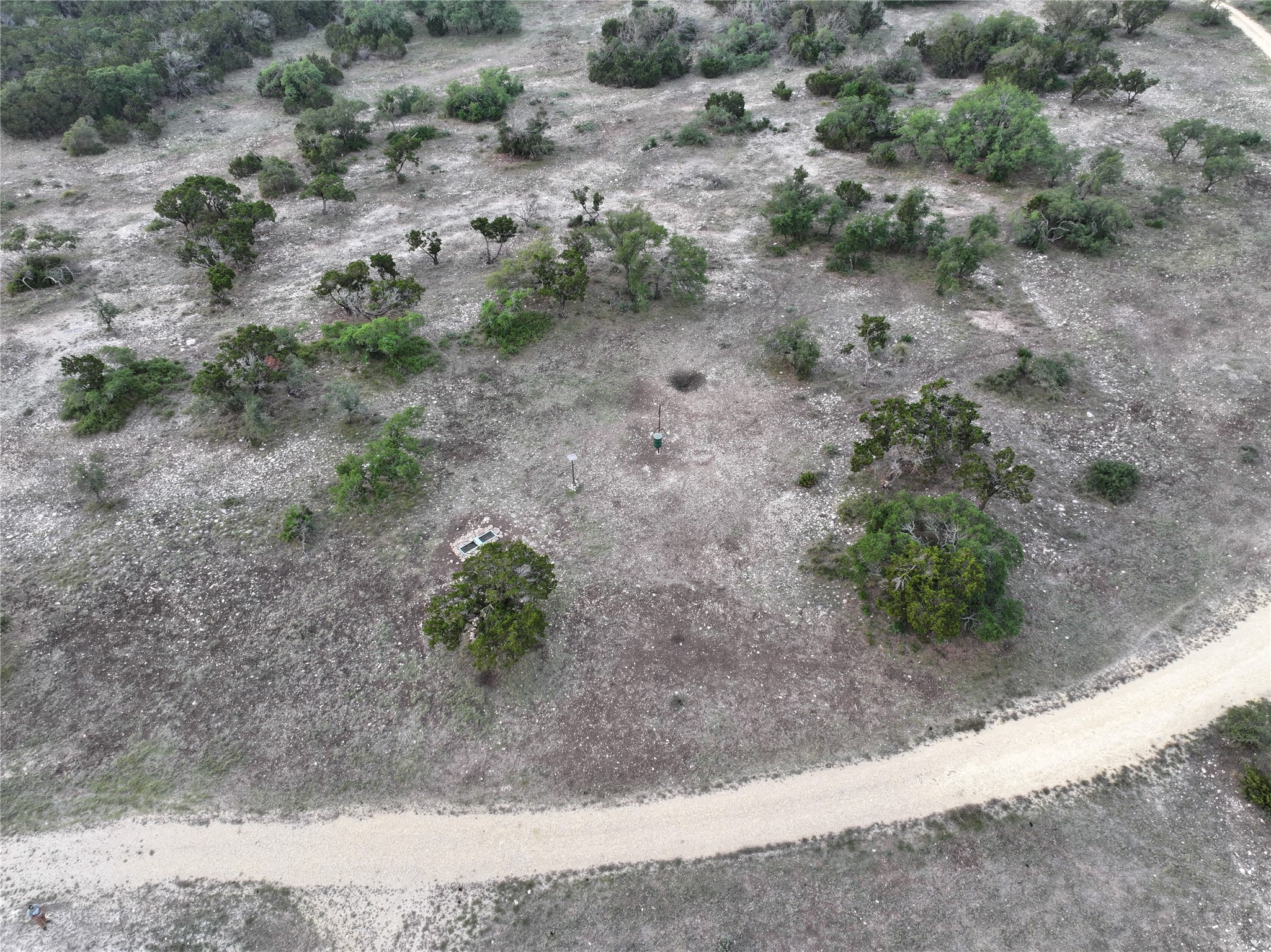220 Rattlesnake Road Northwest Junction, TX 76849 - Photo 15 of 38 a view of a dry yard with lots of green space