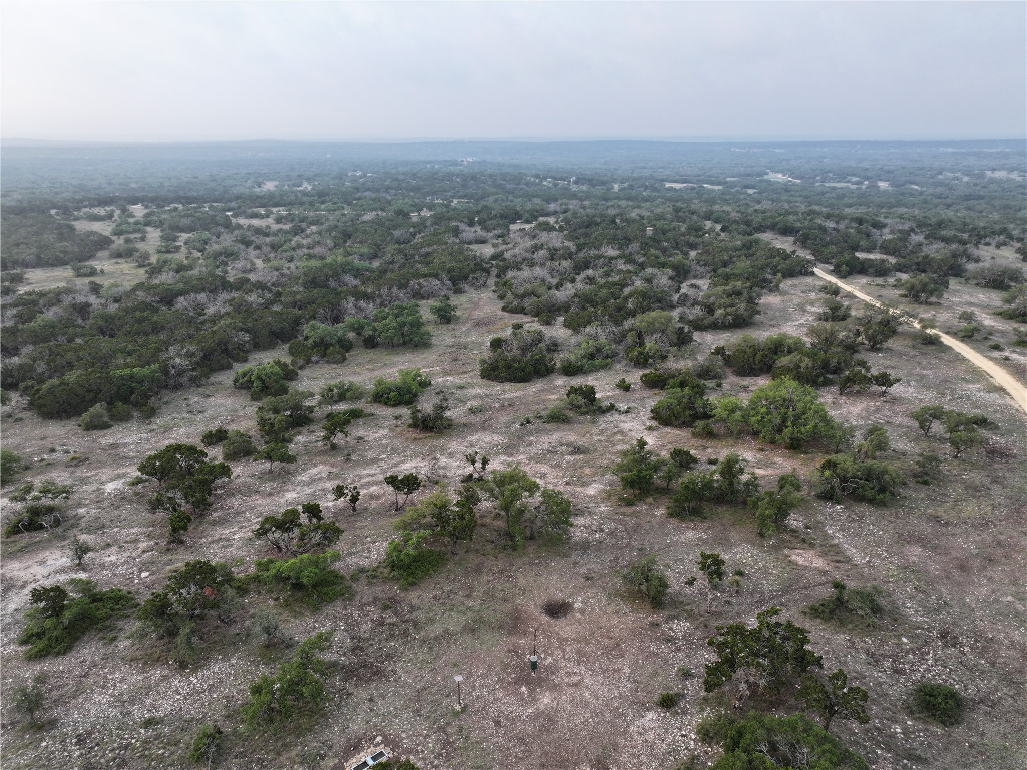 220 Rattlesnake Road Northwest Junction, TX 76849 - Photo 16 of 38 an aerial view of residential houses with outdoor space and trees