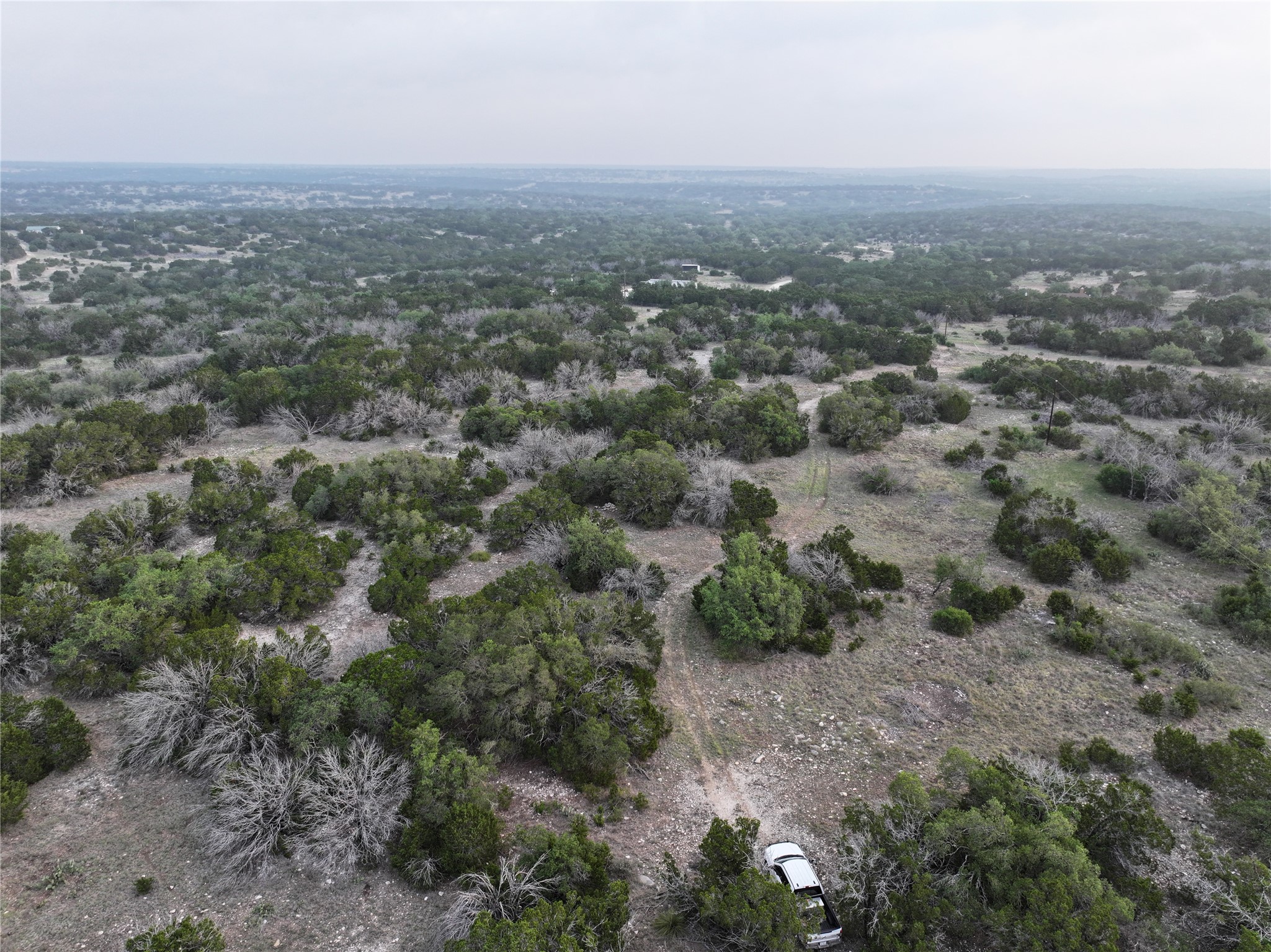 220 Rattlesnake Road Northwest Junction, TX 76849 - Photo 17 of 38 an aerial view of house with yard and mountain view in back