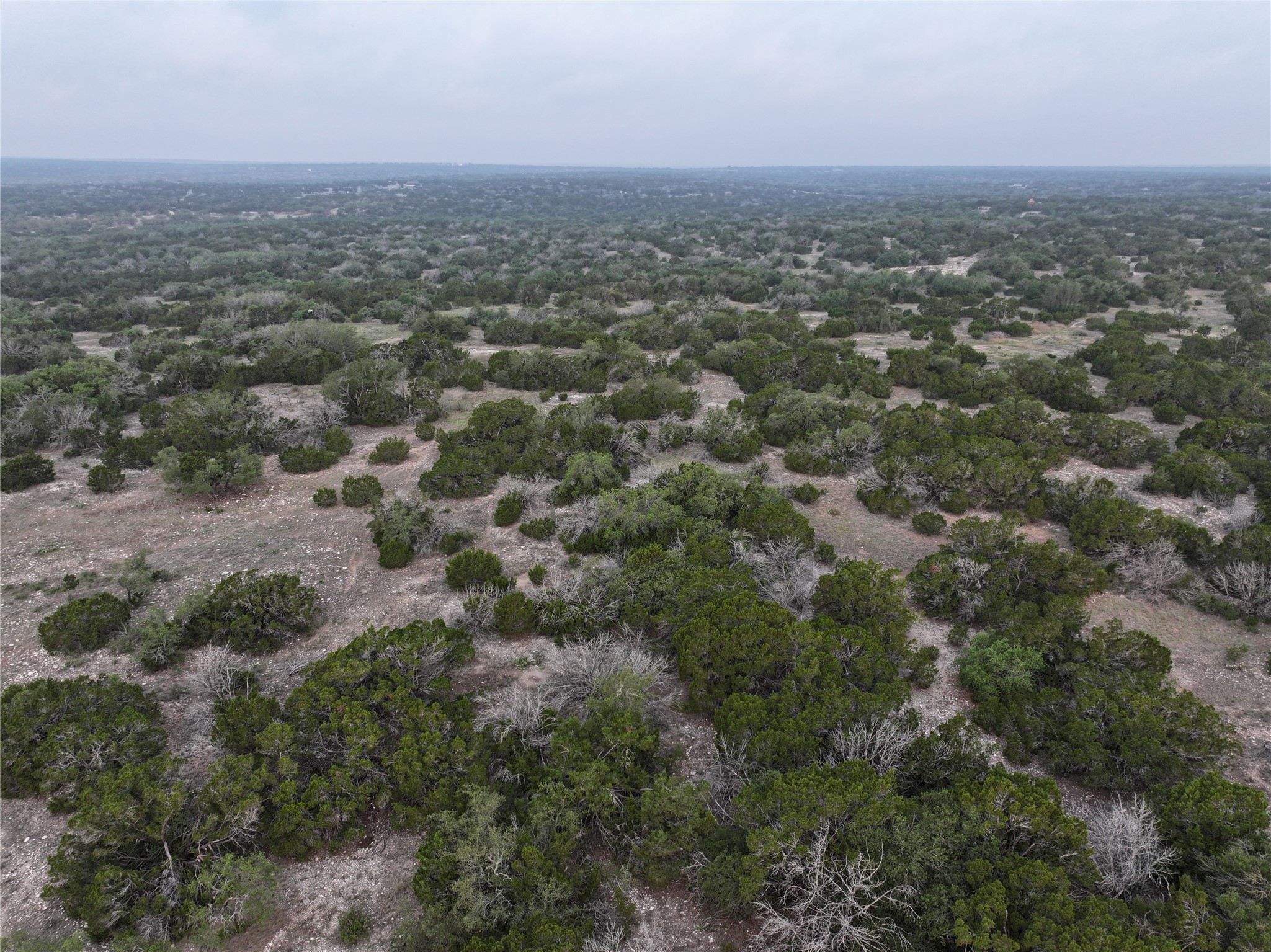 220 Rattlesnake Road Northwest Junction, TX 76849 - Photo 18 of 38 an aerial view of house with yard and mountain view in back