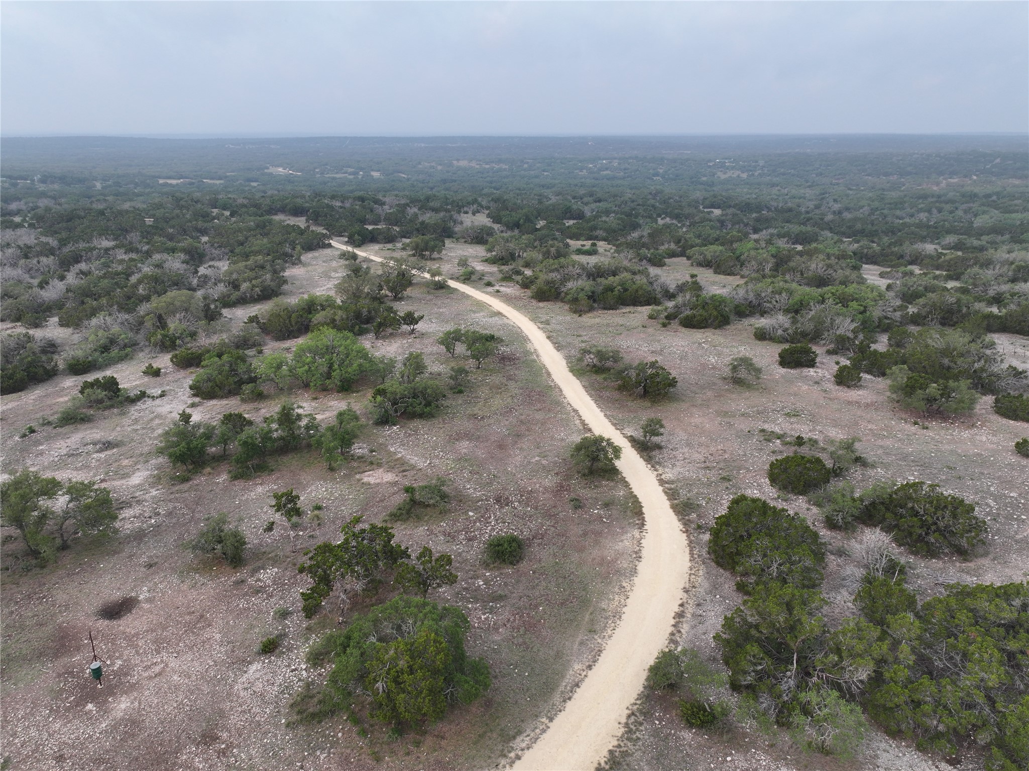 220 Rattlesnake Road Northwest Junction, TX 76849 - Photo 19 of 38 an aerial view of a house with a yard
