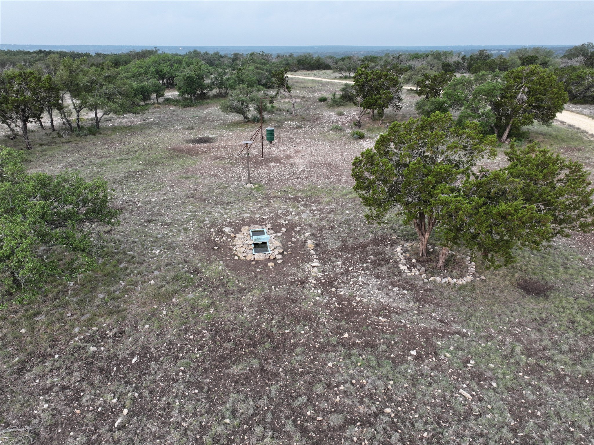 220 Rattlesnake Road Northwest Junction, TX 76849 - Photo 20 of 38 a view of a dry yard with trees