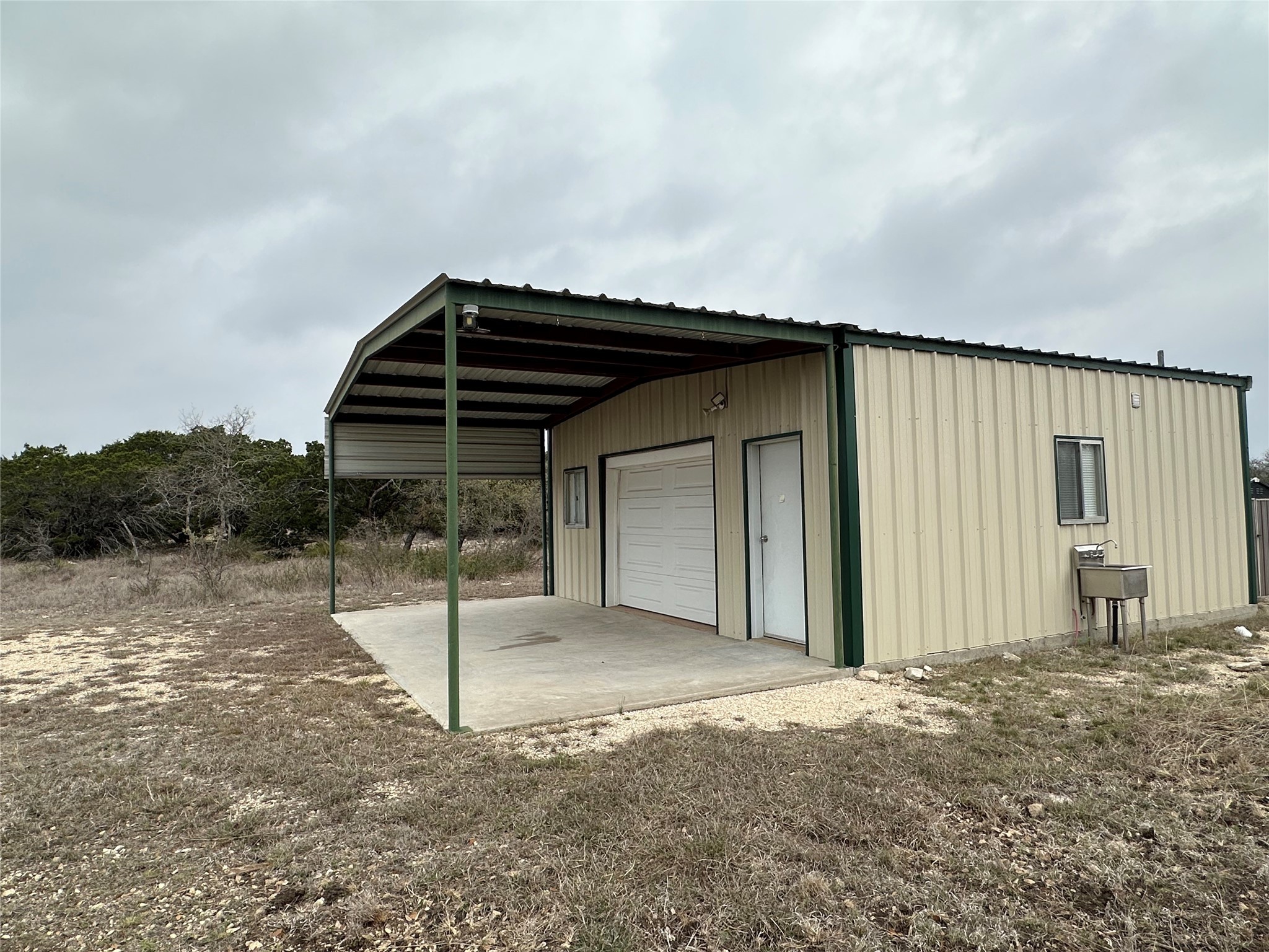 220 Rattlesnake Road Northwest Junction, TX 76849 - Photo 22 of 38 a view of a house with backyard