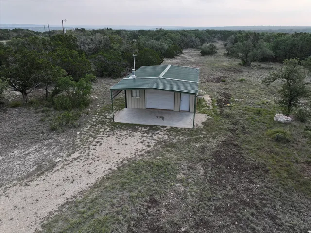 an aerial view of a house having yard