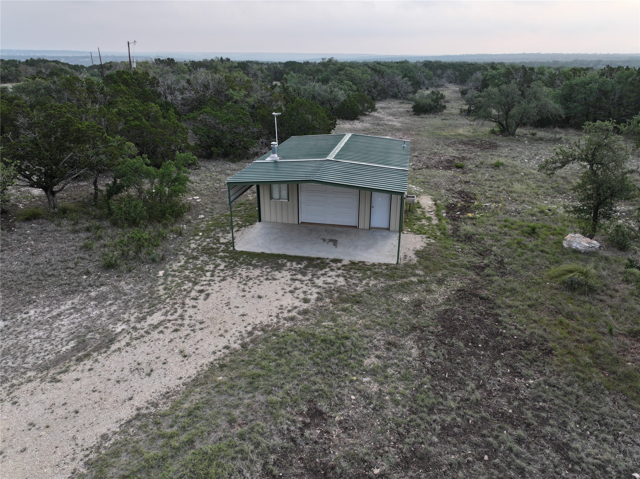 220 Rattlesnake Road Northwest Junction, TX 76849 - Photo 25 of 38 a view of a small house with a yard