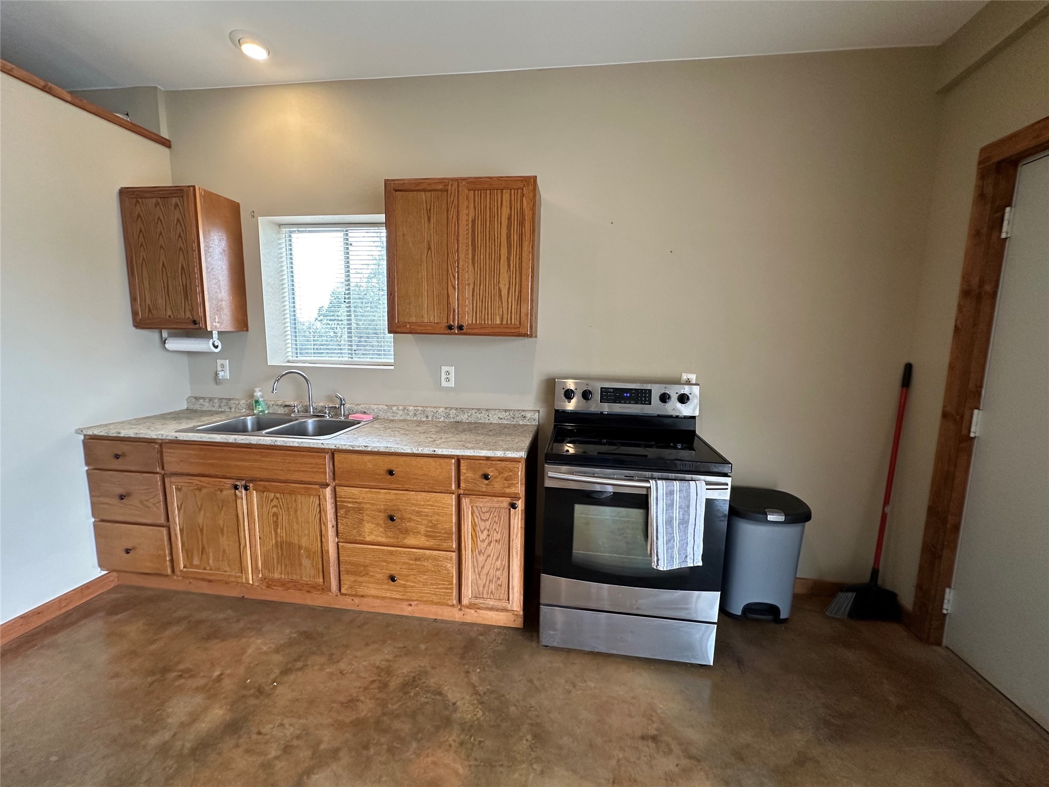 220 Rattlesnake Road Northwest Junction, TX 76849 - Photo 27 of 38 a kitchen with stainless steel appliances granite countertop a stove a sink and a microwave