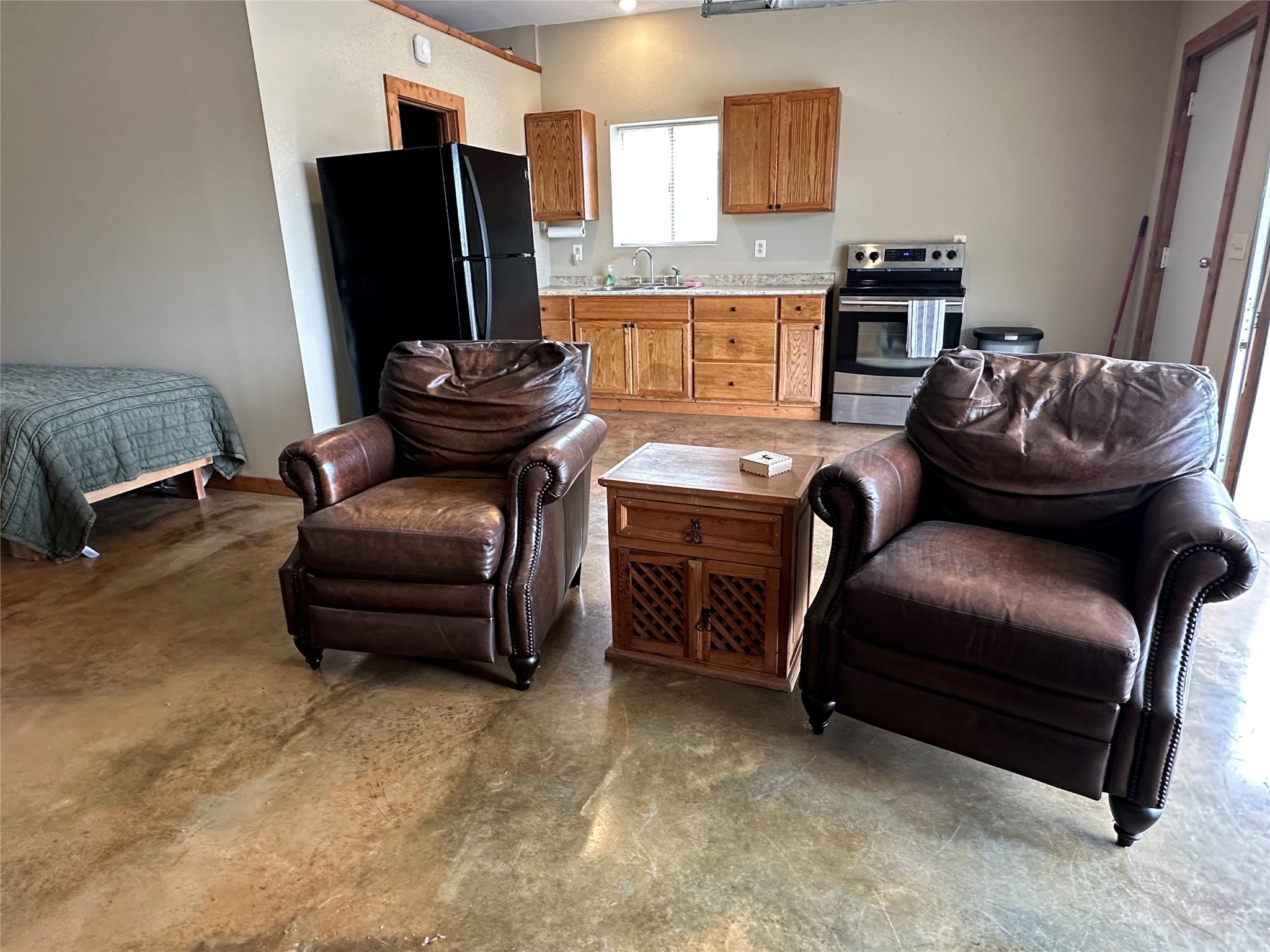 220 Rattlesnake Road Northwest Junction, TX 76849 - Photo 30 of 38 a living room with furniture and a flat screen tv