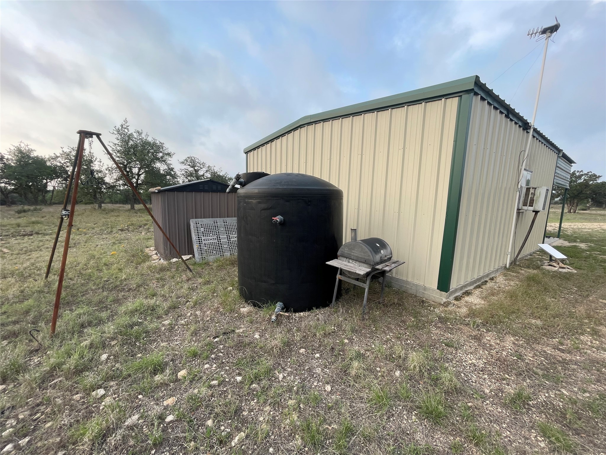 220 Rattlesnake Road Northwest Junction, TX 76849 - Photo 36 of 38 a view of a backyard with table and chairs