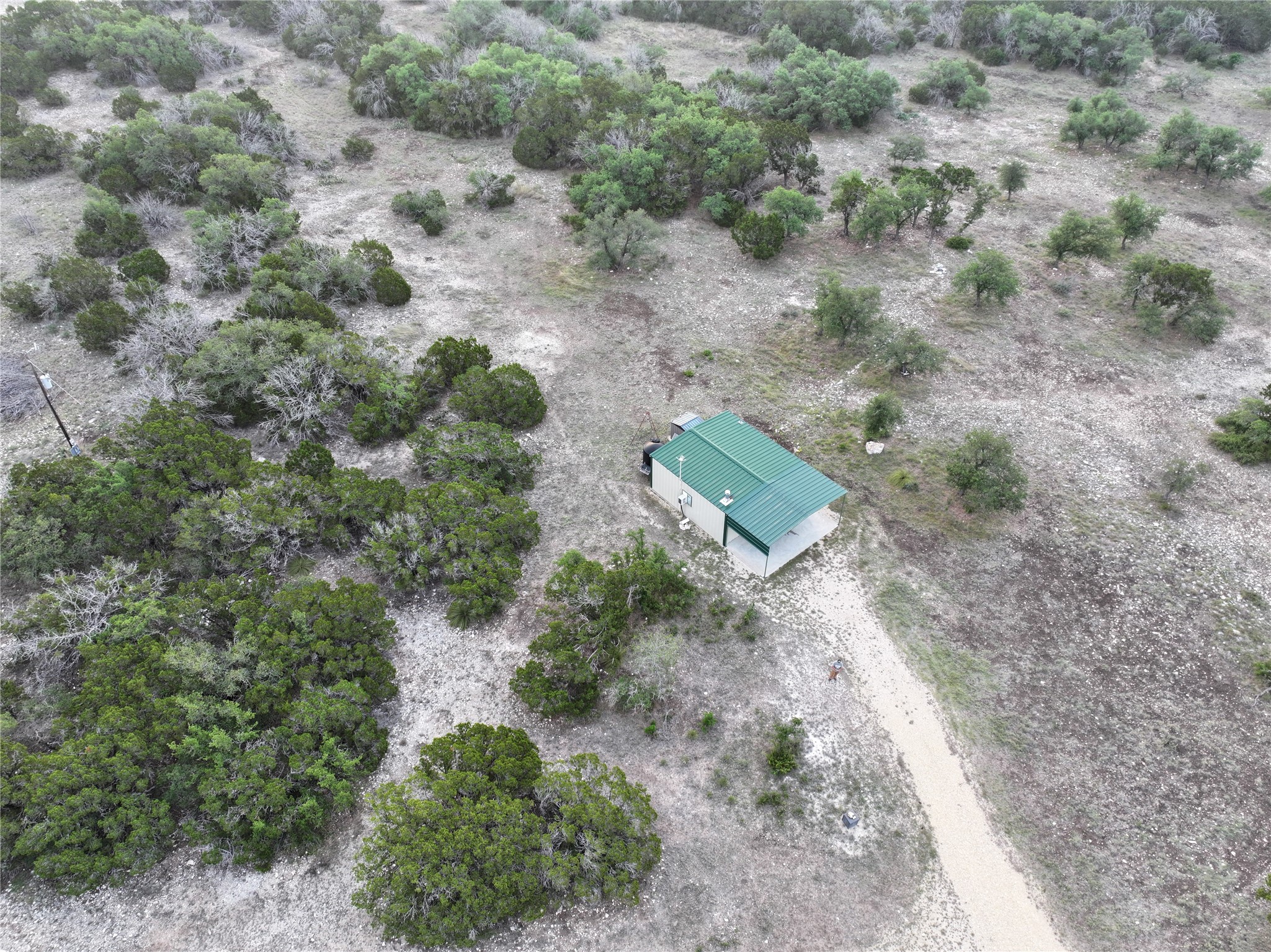 220 Rattlesnake Road Northwest Junction, TX 76849 - Photo 8 of 38 an aerial view of a house with a yard