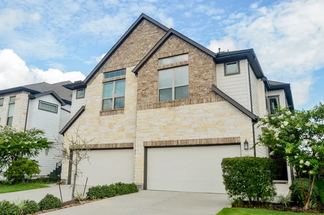 a view of a house with a garage
