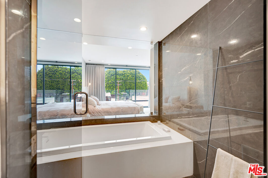 1017 North Croft Avenue, Unit PH1 Los Angeles, CA 90069 - Photo 19 of 34 a bathroom with a sink and a bathtub