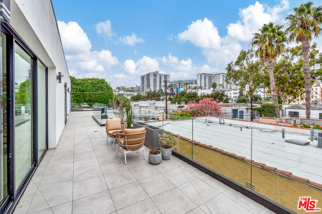 1017 North Croft Avenue, Unit PH1 Los Angeles, CA 90069 - Photo 28 of 34 a view of a terrace with skyline