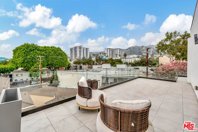 a view of a terrace with sitting area