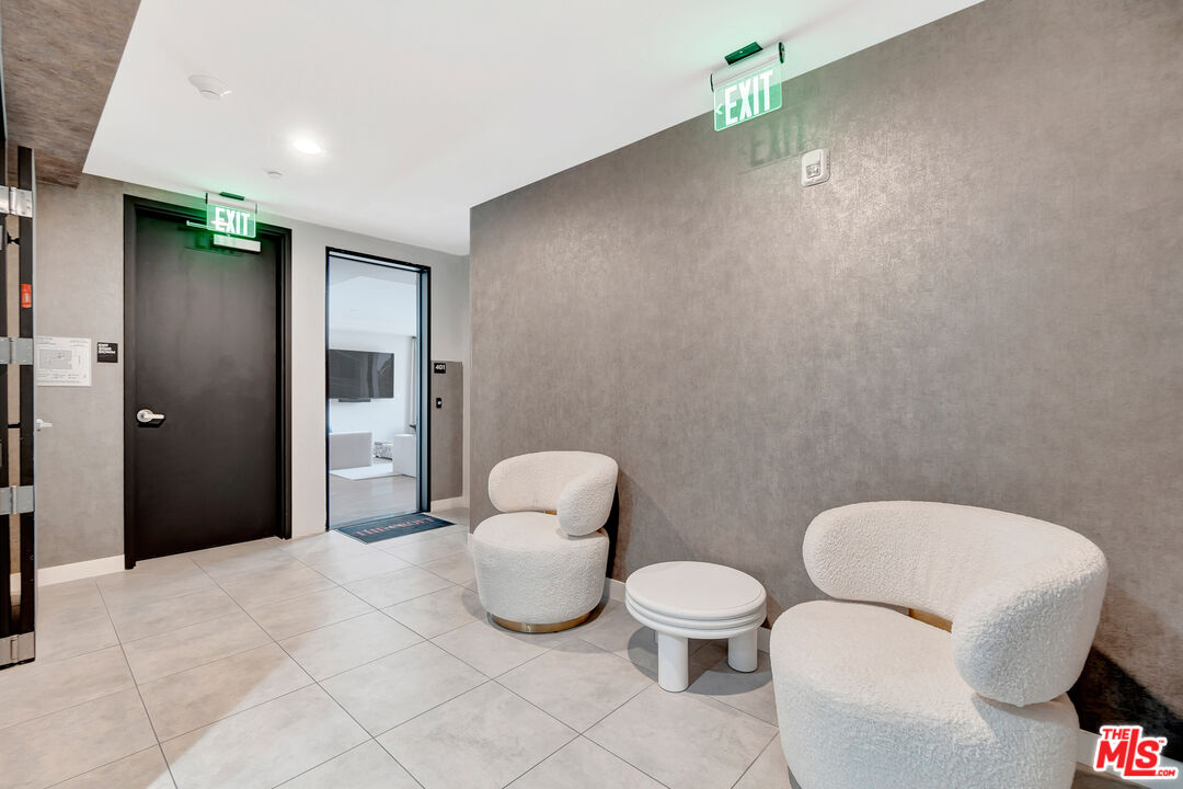 1017 North Croft Avenue, Unit PH1 Los Angeles, CA 90069 - Photo 32 of 34 a bathroom with a toilet sink and mirror