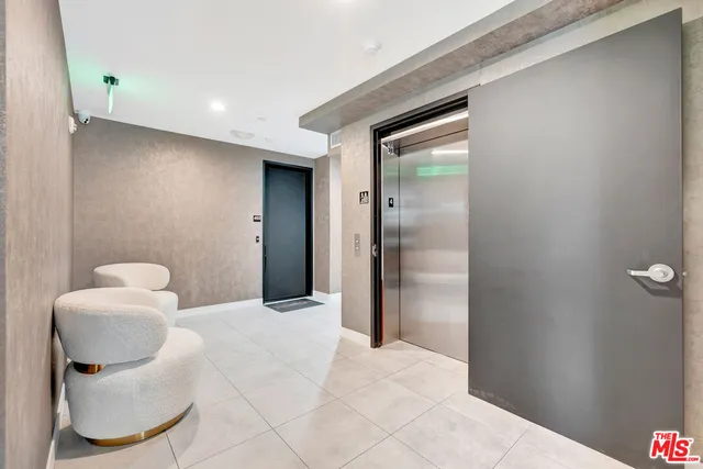 a view of an empty room and bathroom