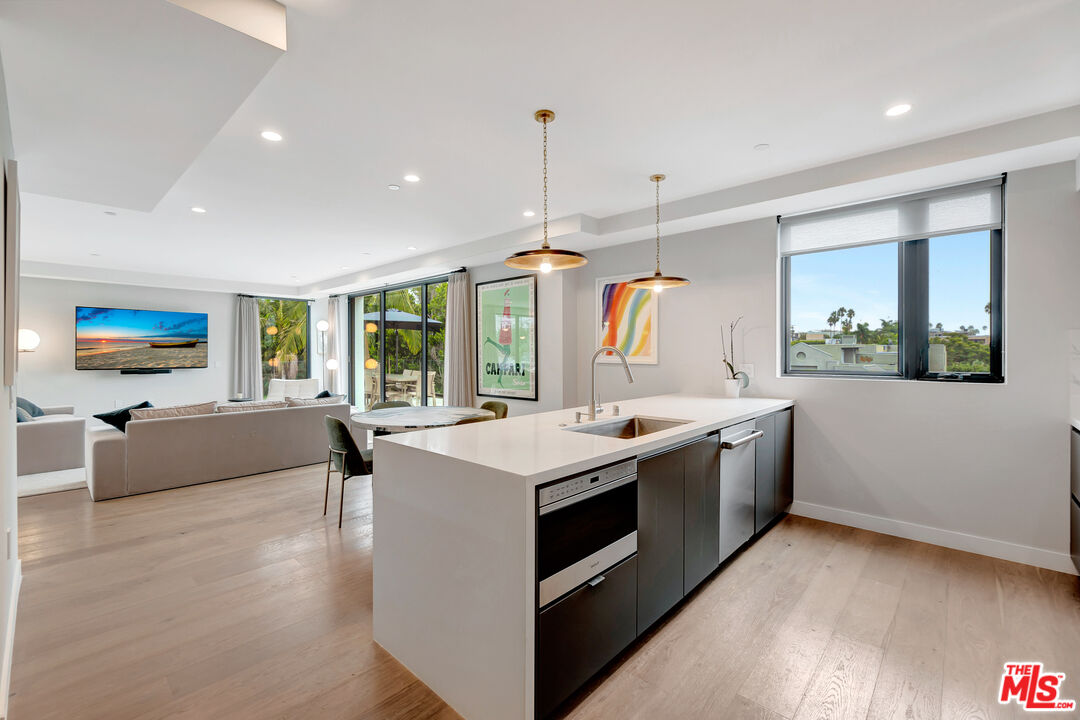 1017 North Croft Avenue, Unit PH1 Los Angeles, CA 90069 - Photo 6 of 34 a kitchen with a stove and a sink