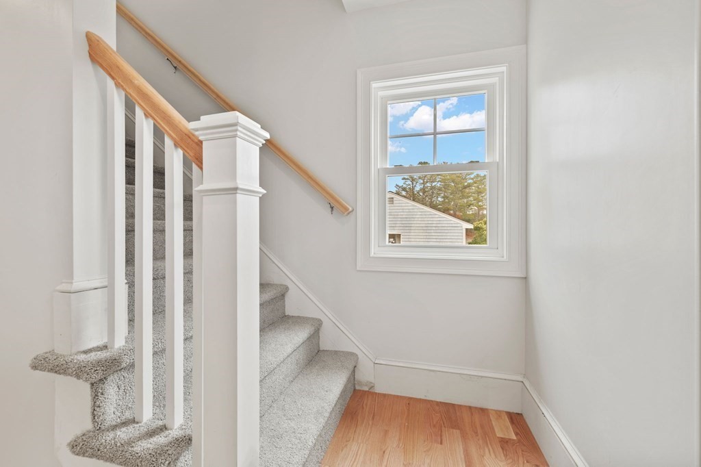 180 Barker Road East Wareham, MA 02538 - Photo 11 of 29 a view of hallway with stairs and wooden floor