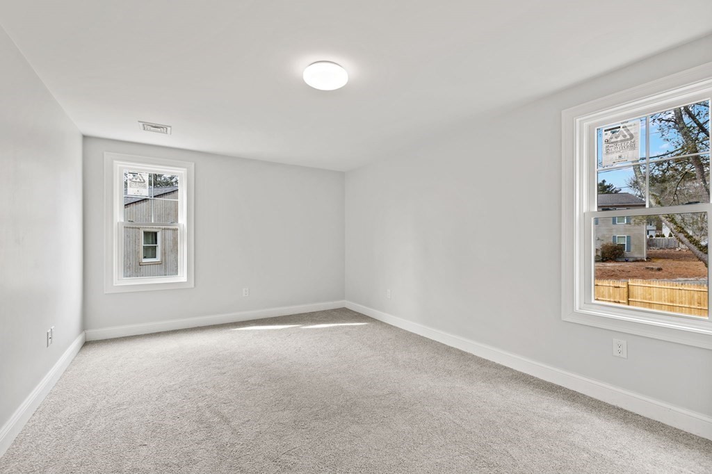 180 Barker Road East Wareham, MA 02538 - Photo 17 of 29 an empty room with windows