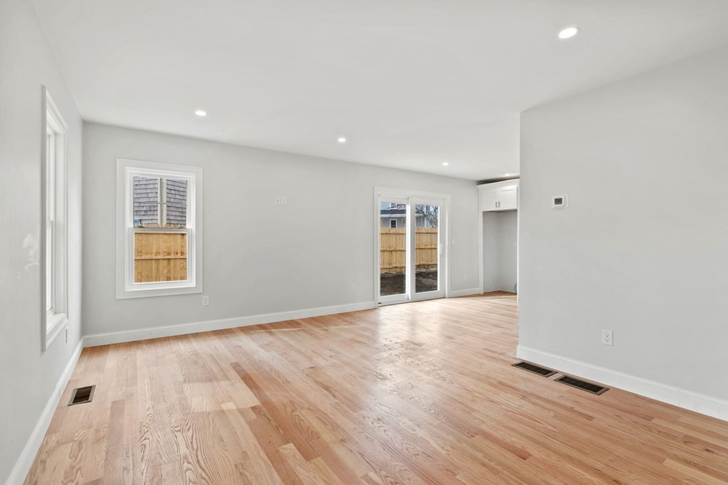 180 Barker Road East Wareham, MA 02538 - Photo 19 of 29 an empty room with wooden floor and windows