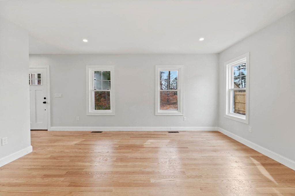 180 Barker Road East Wareham, MA 02538 - Photo 22 of 29 a view of an empty room with a window and wooden floor