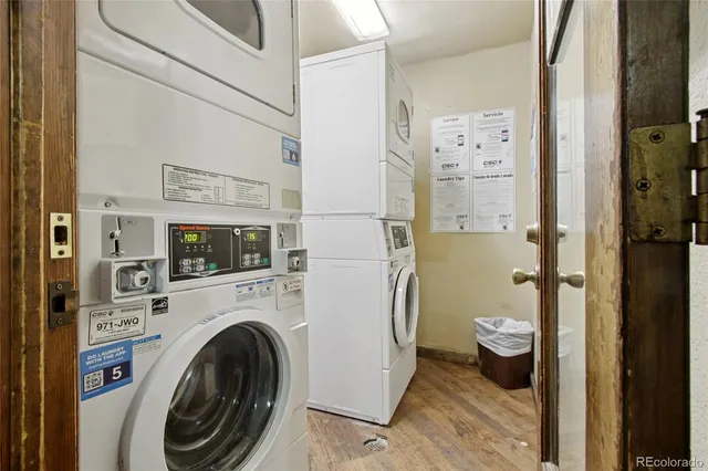 a living room with fireplace furniture and a floor to ceiling window