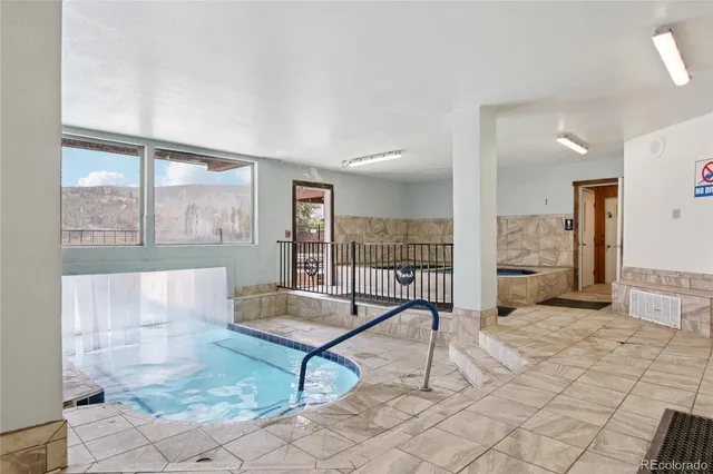 a view of a cafe with sitting area