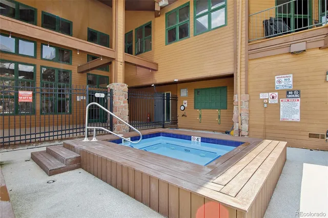 a view of a terrace with furniture and city view